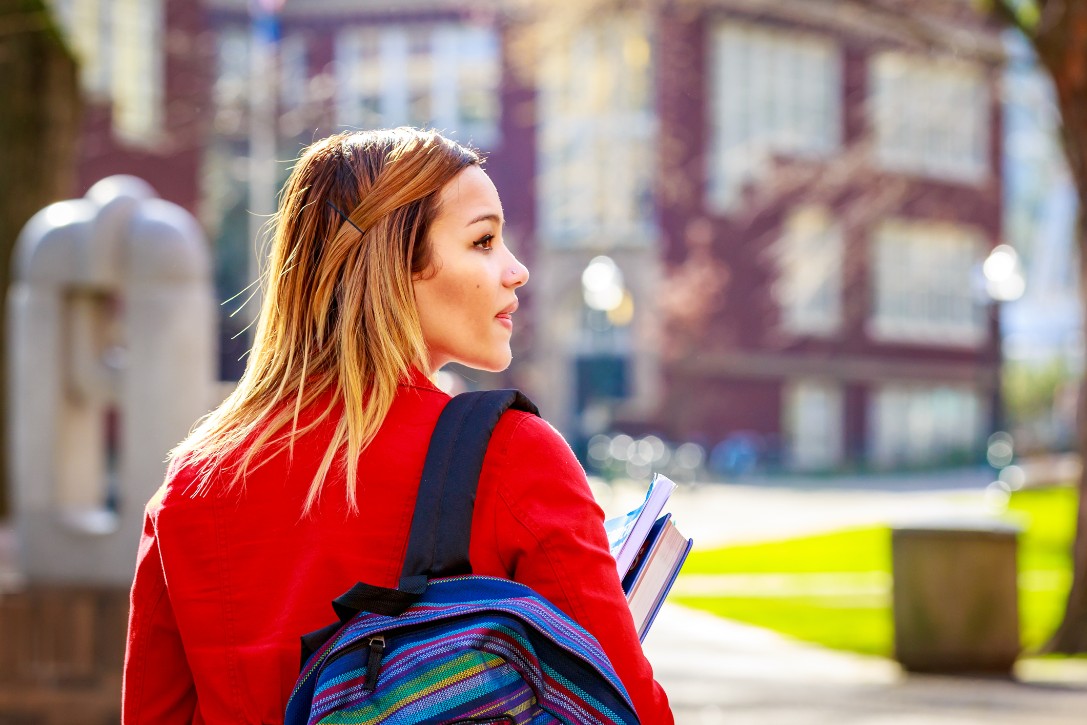 A young female college student between classes.